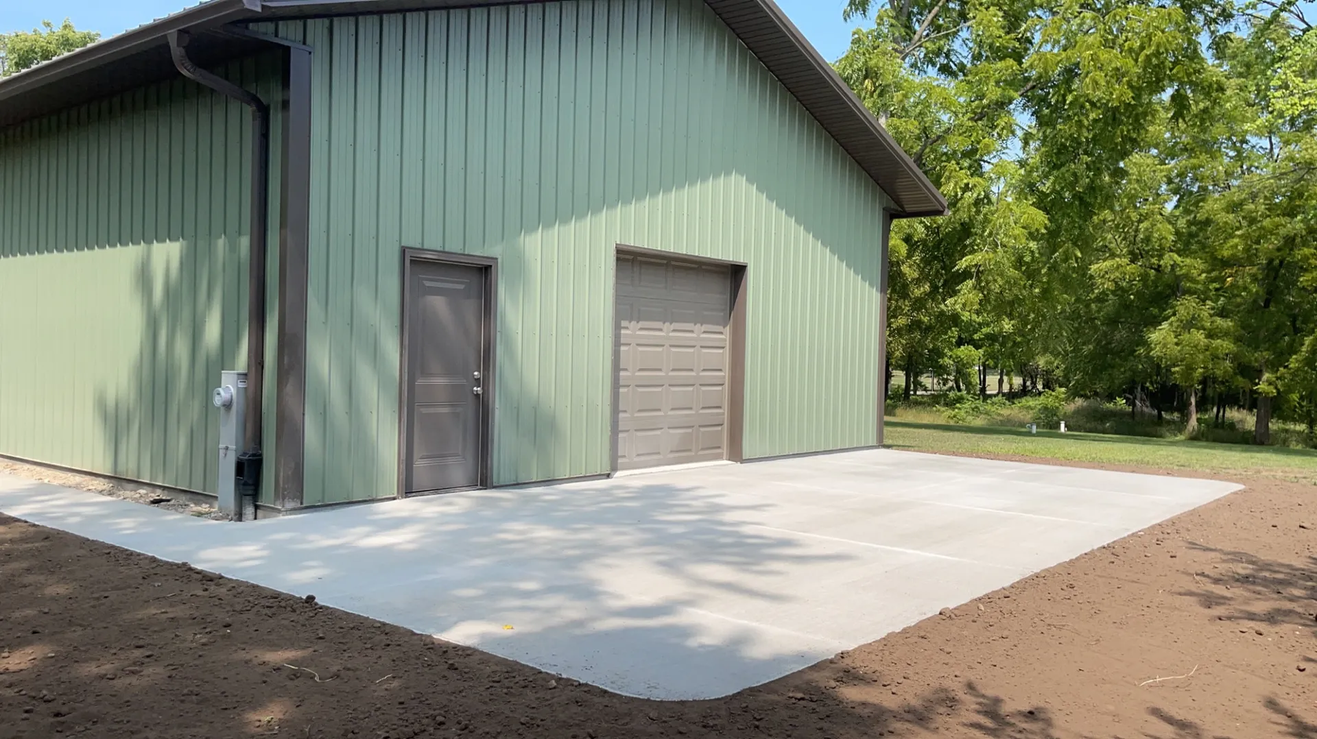 Plain concrete pad before stamped concrete treatment